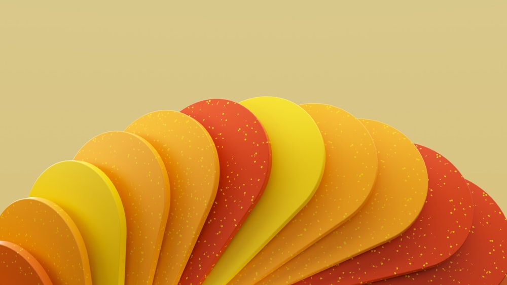 a close up of a colorful object with a yellow background