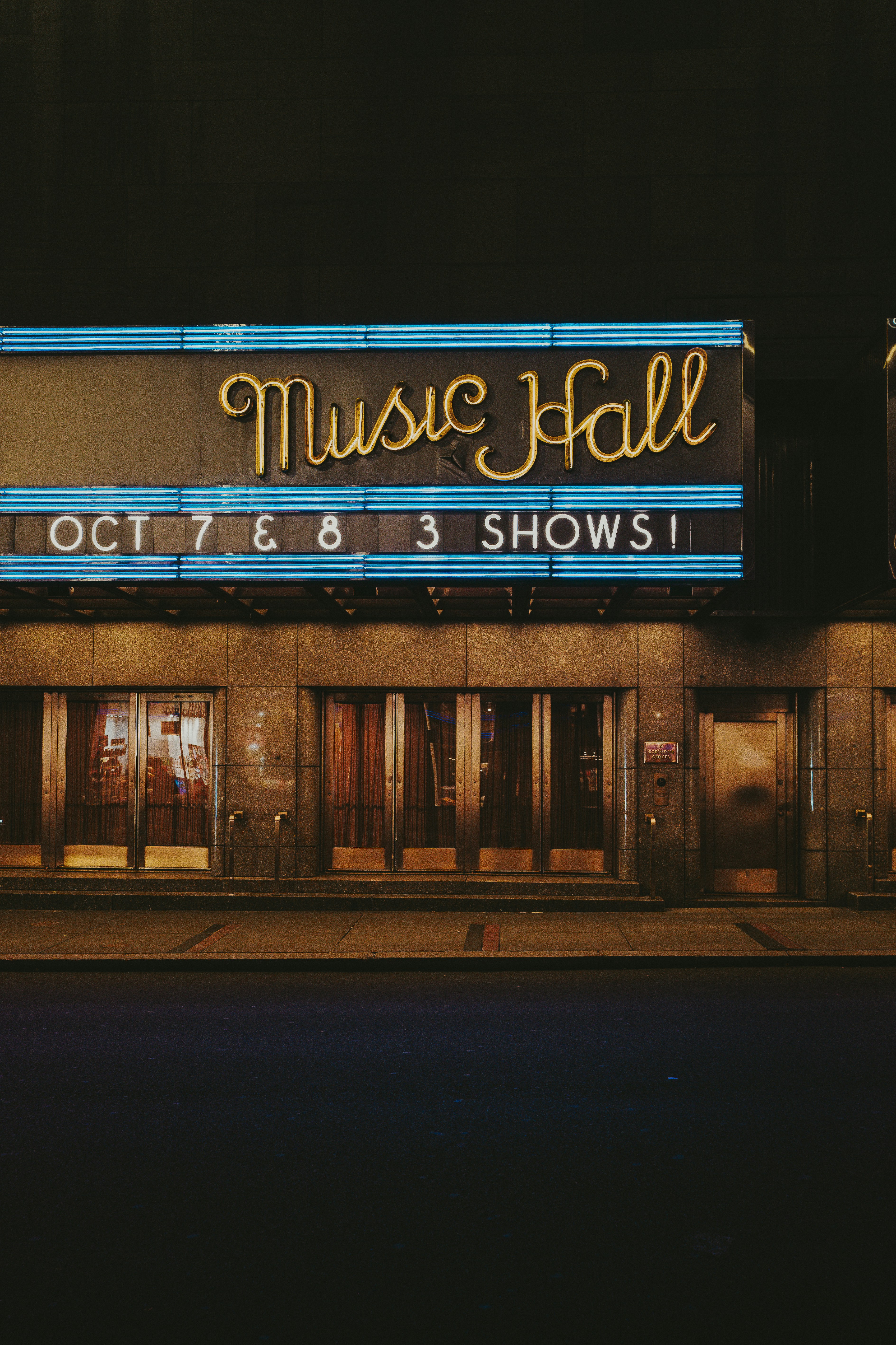 a building with a sign that says music hall