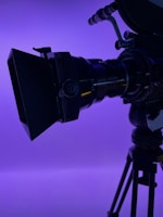 Close-up of a film camera capturing a dramatic movie scene