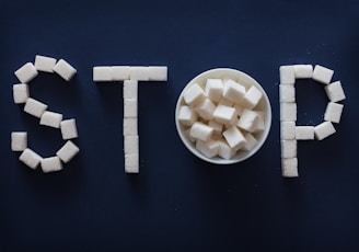 the word stop spelled out of marshmallows in a bowl