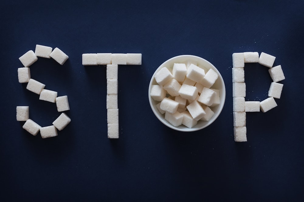 the word stop spelled out of marshmallows in a bowl