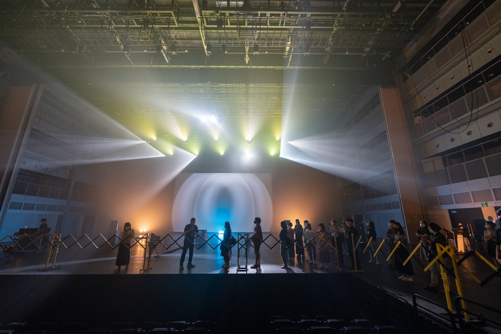 a group of people standing on top of a stage