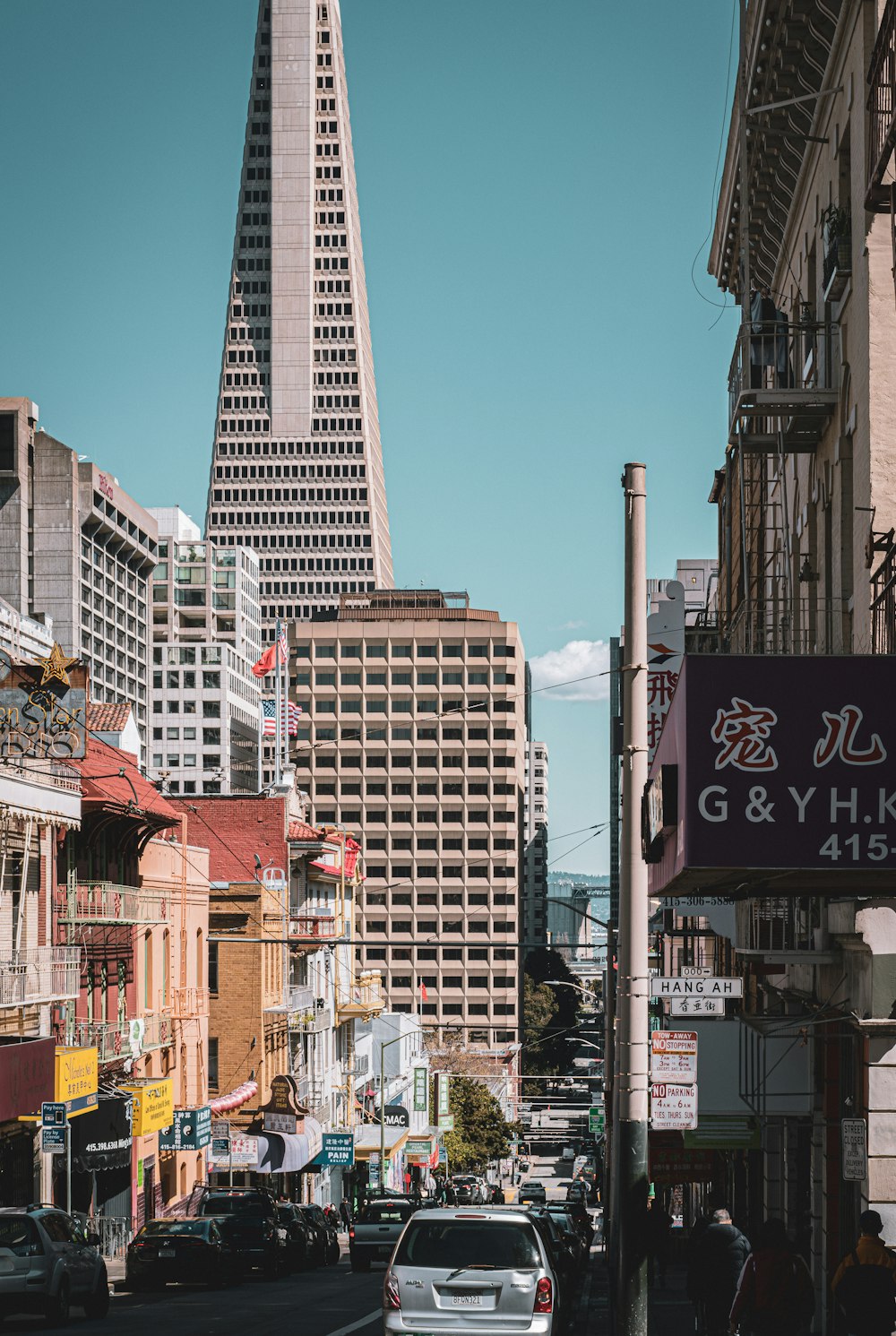 a city street filled with lots of tall buildings