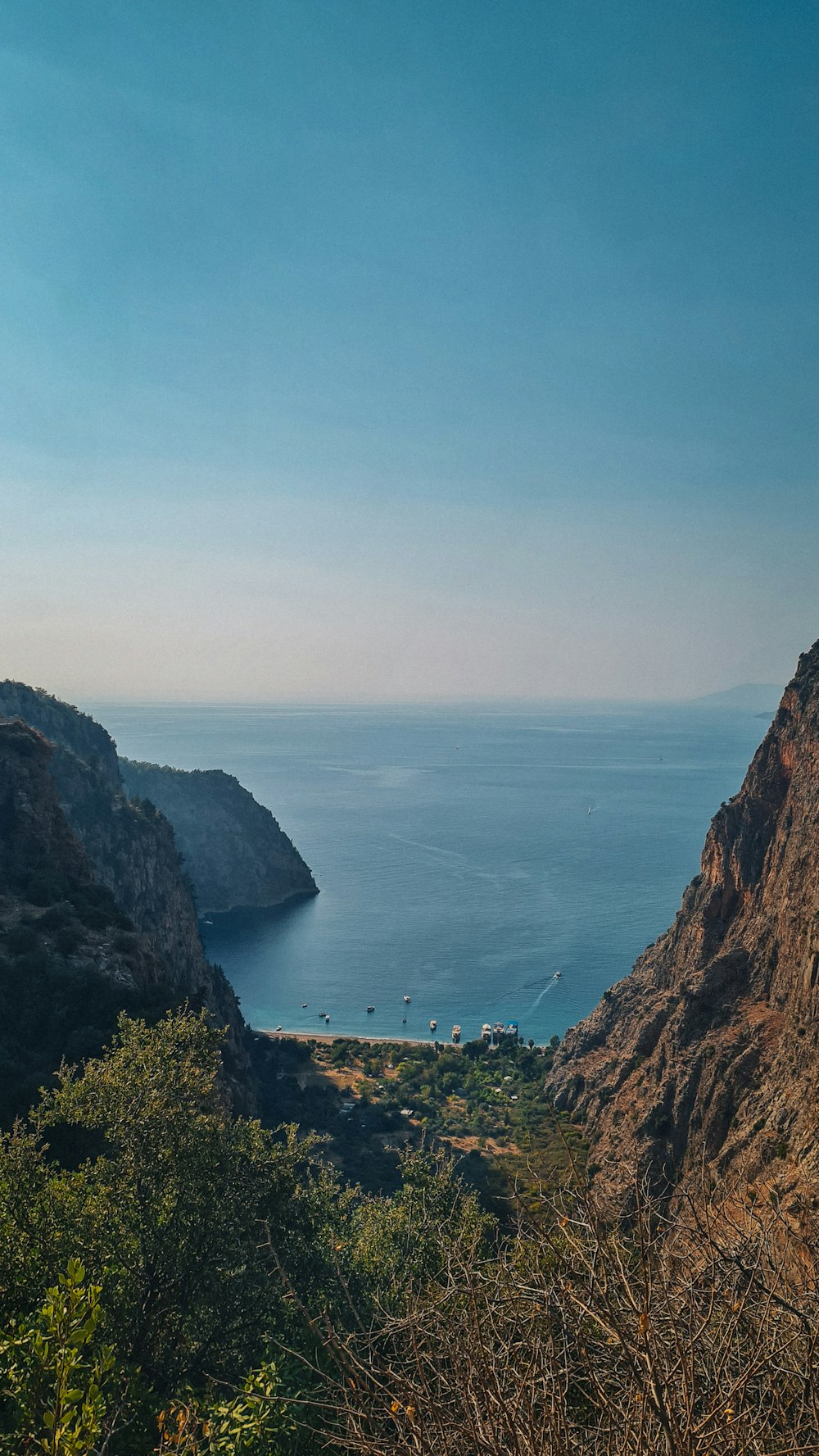 a view of the ocean from the top of a mountain