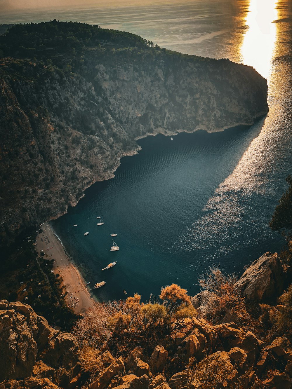 a body of water surrounded by mountains and trees