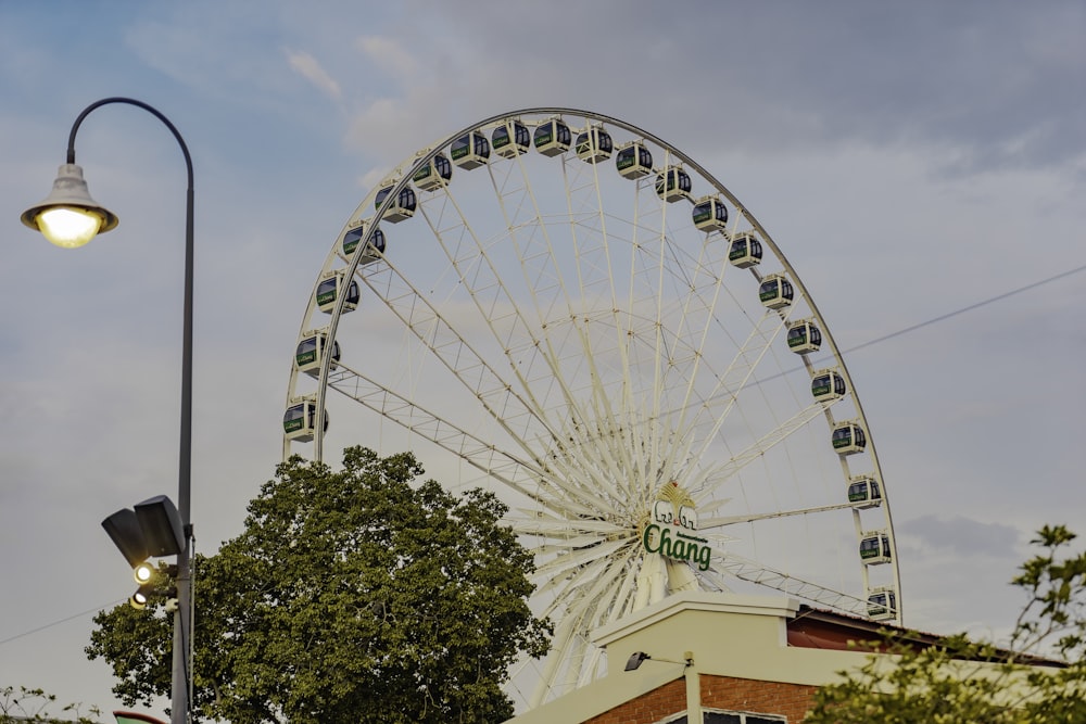a large ferris wheel sitting next to a building