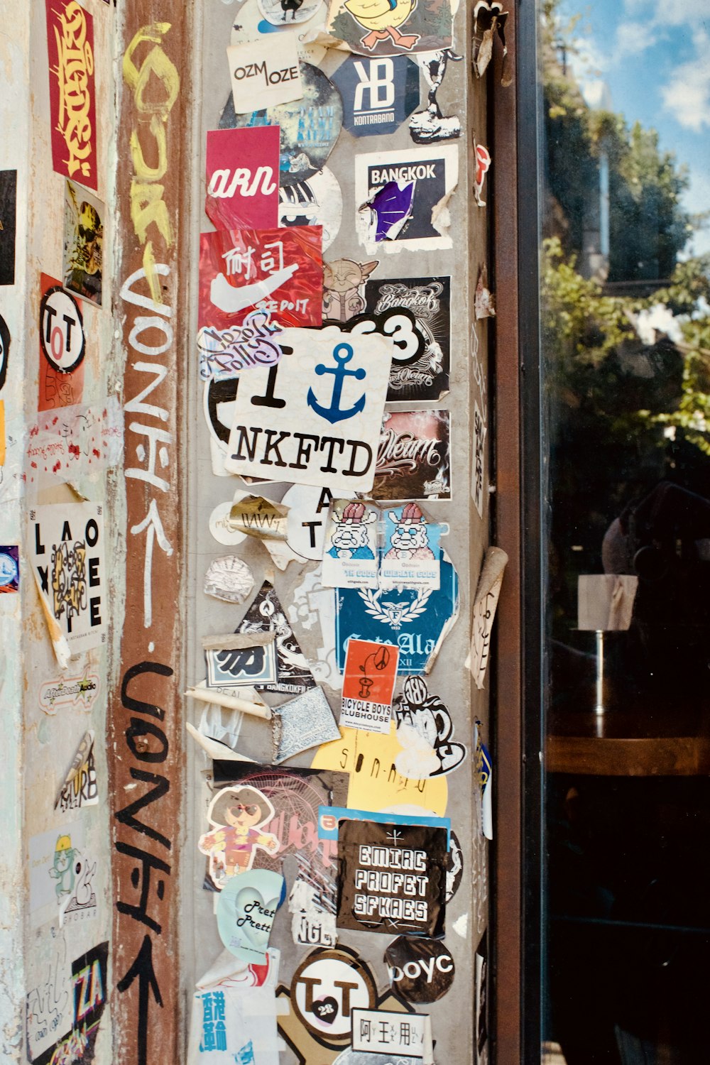 a bunch of stickers are on a door