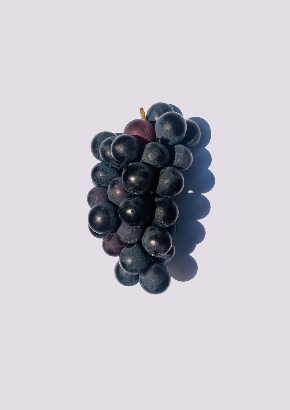 a bunch of grapes sitting on top of a table
