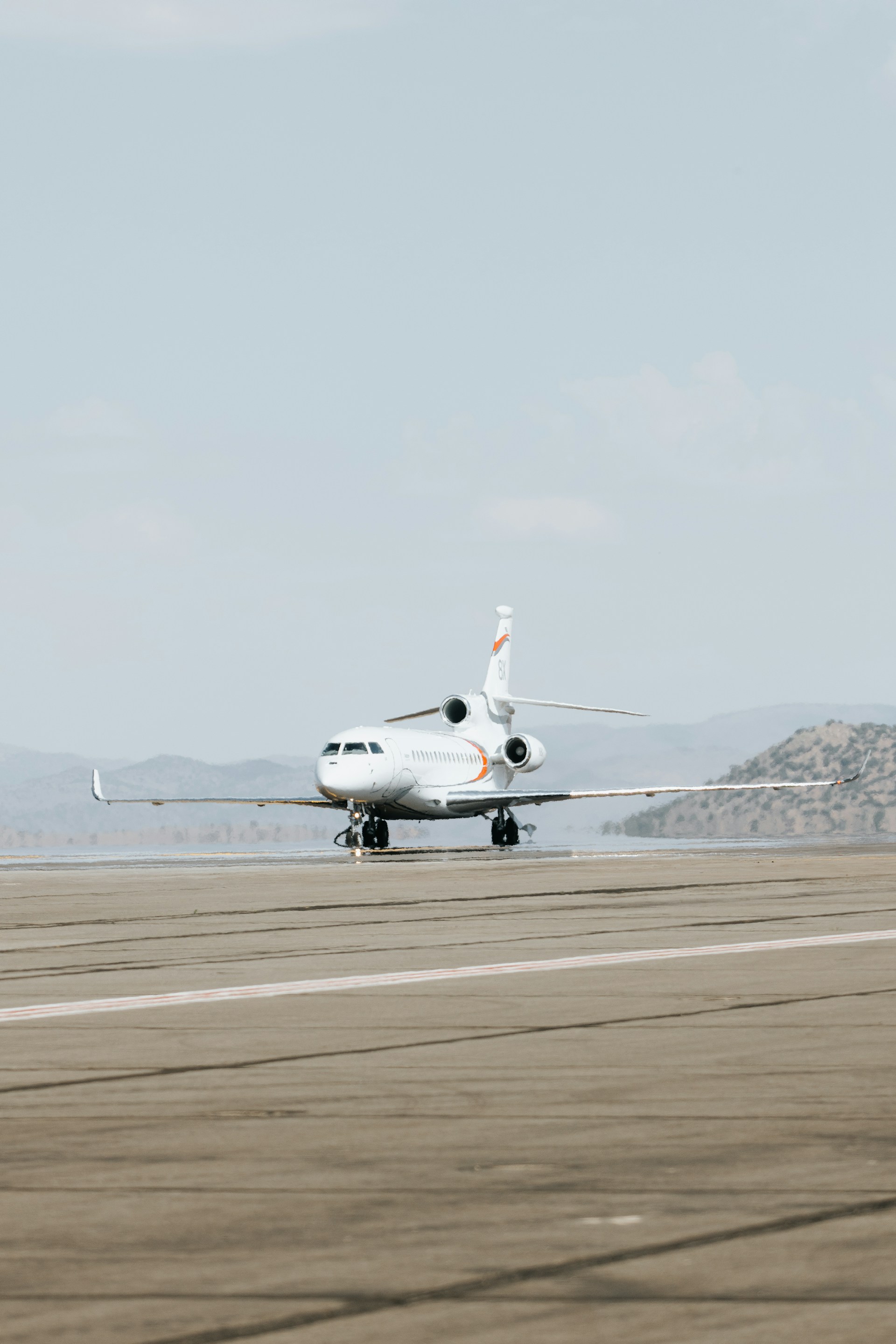 a large jetliner sitting on top of an airport runway