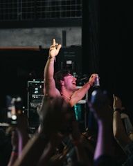 A party host handing out branded product samples to excited attendees.