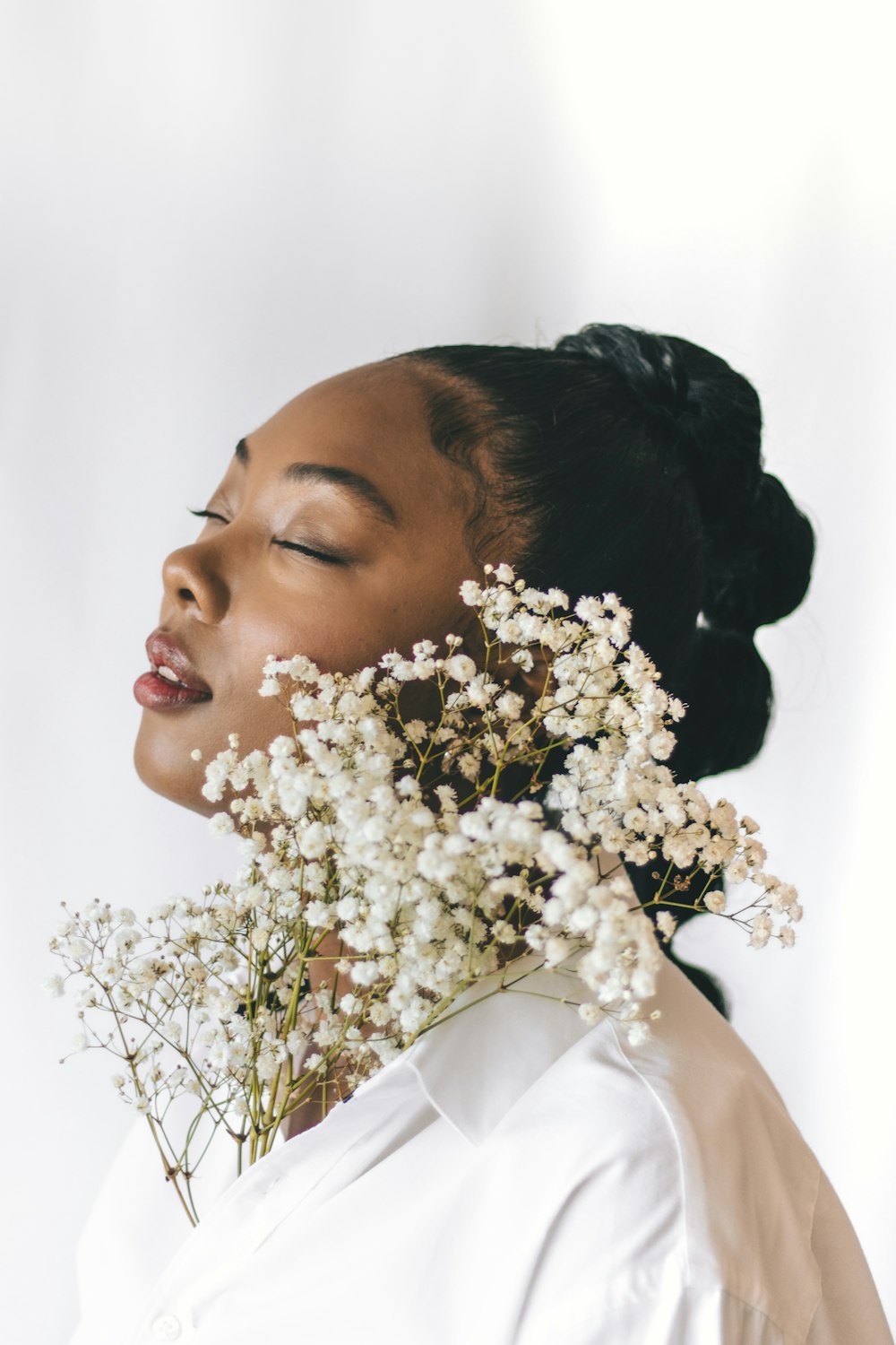 a woman with a flower in her hair