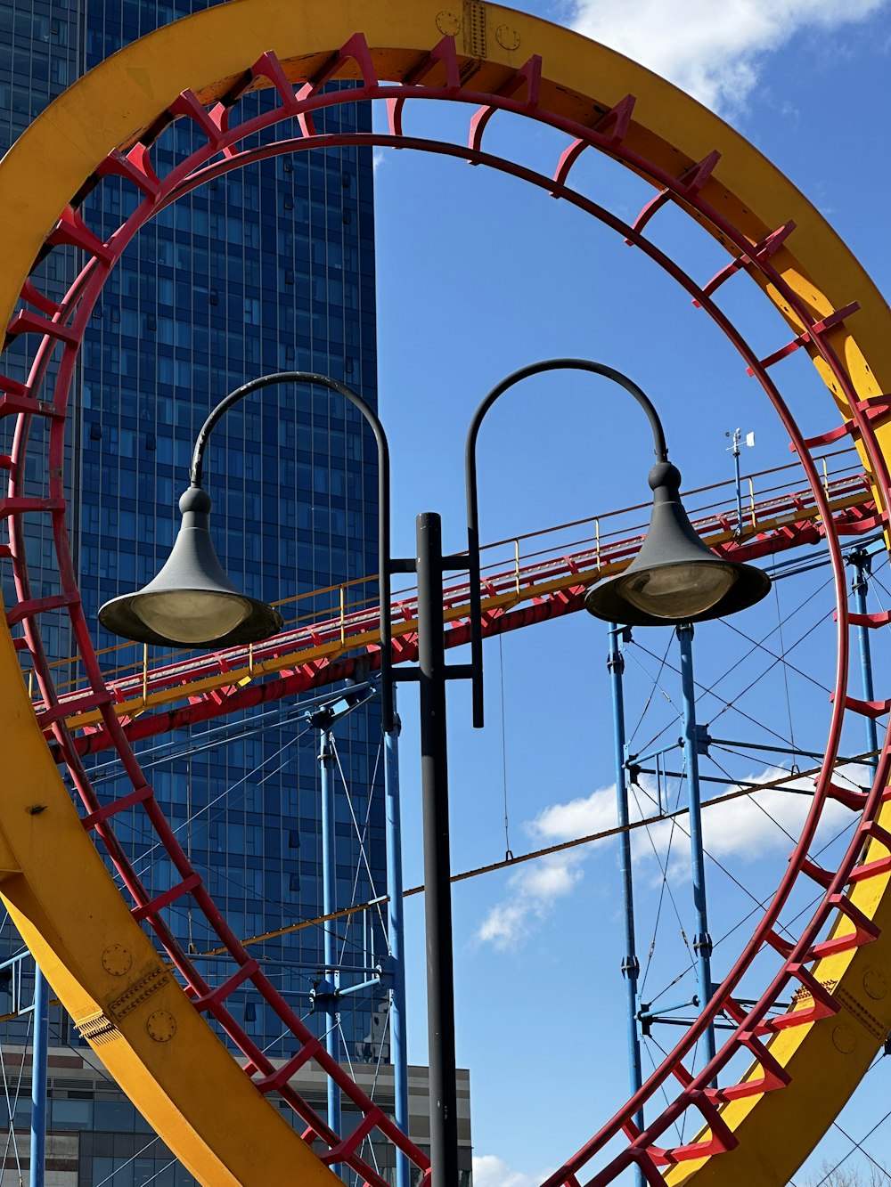 a giant ferris wheel in front of a tall building