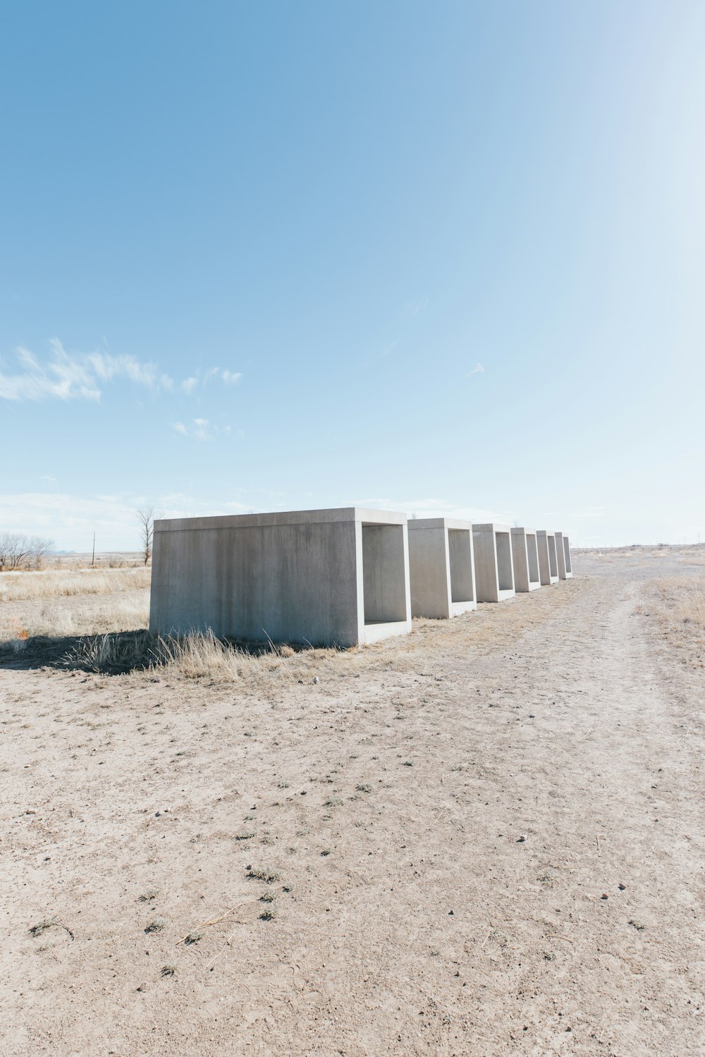 a row of concrete blocks sitting in the middle of a desert