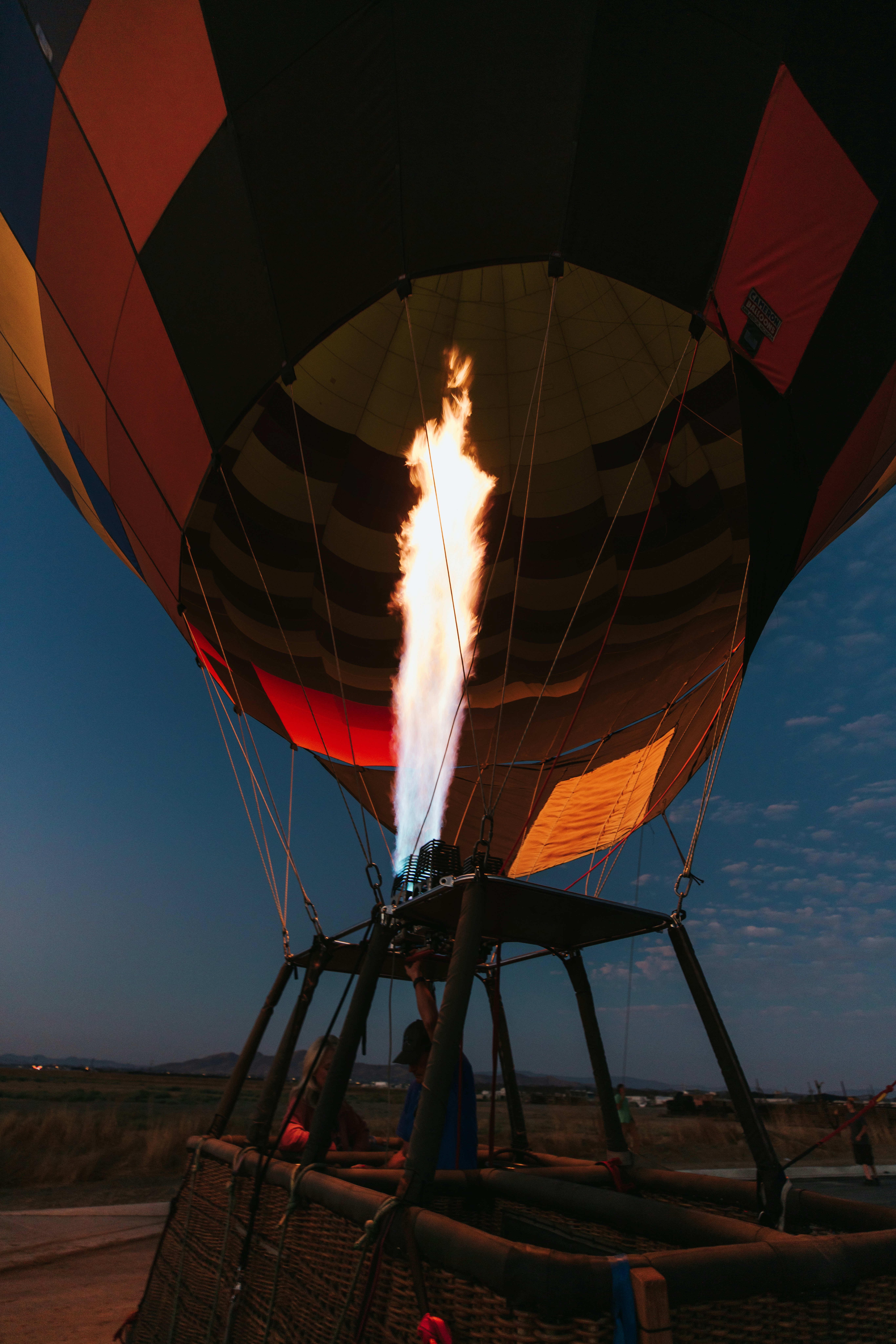 a large hot air balloon with a flame coming out of it