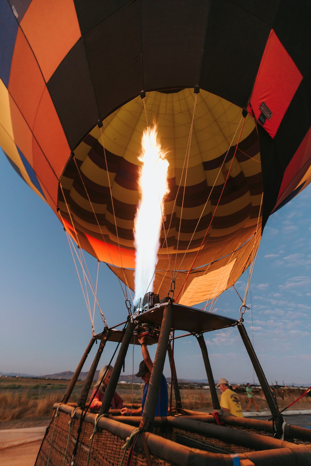 a hot air balloon with a flame coming out of it