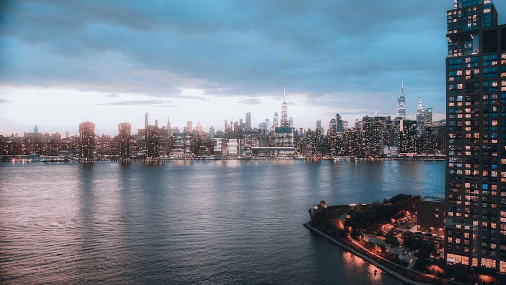 a large body of water with a city in the background