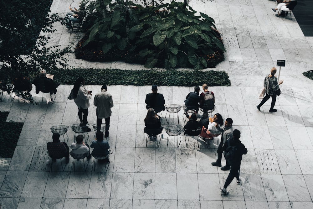 a group of people standing around a courtyard
