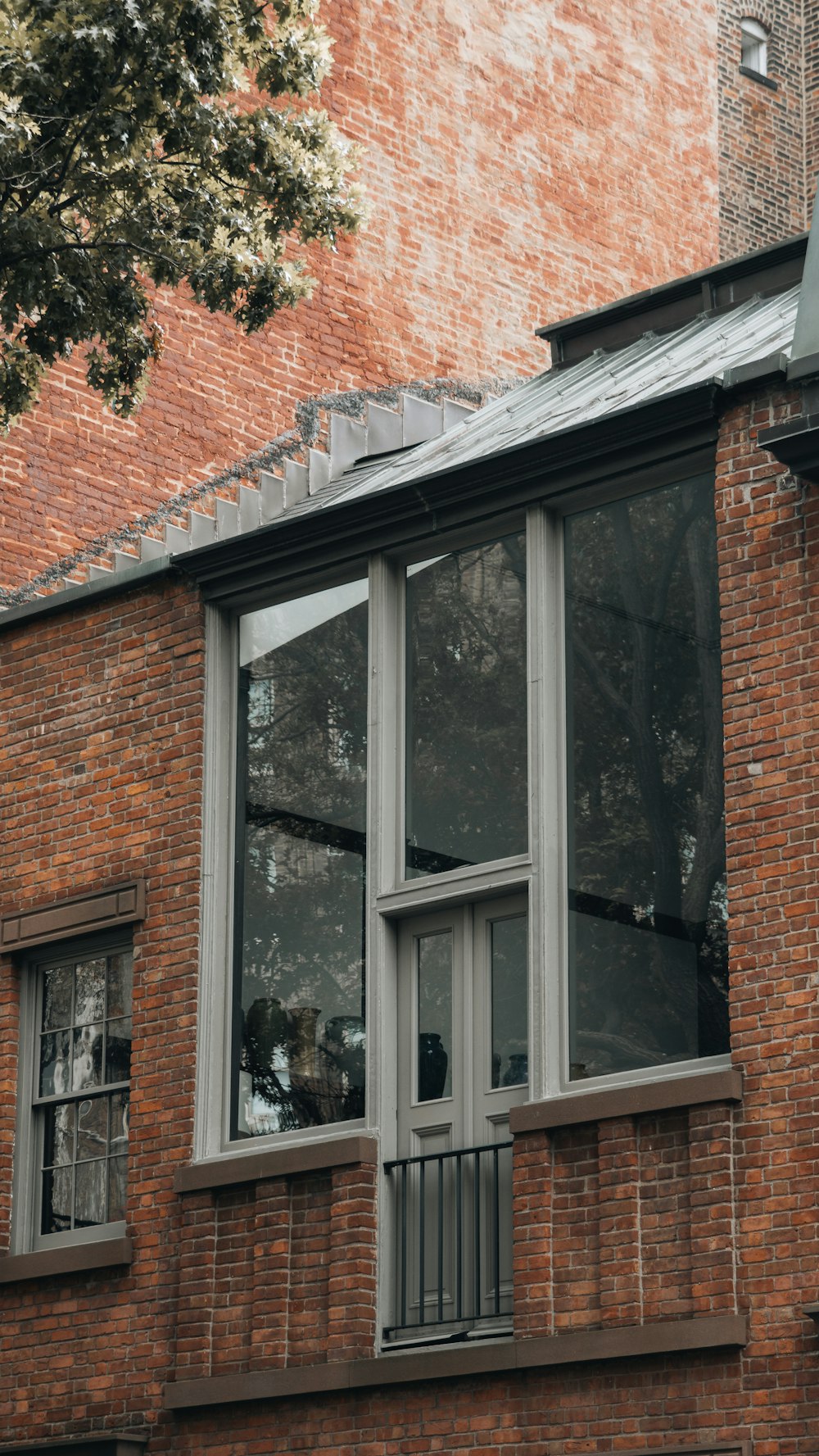 a brick building with a clock on the front of it