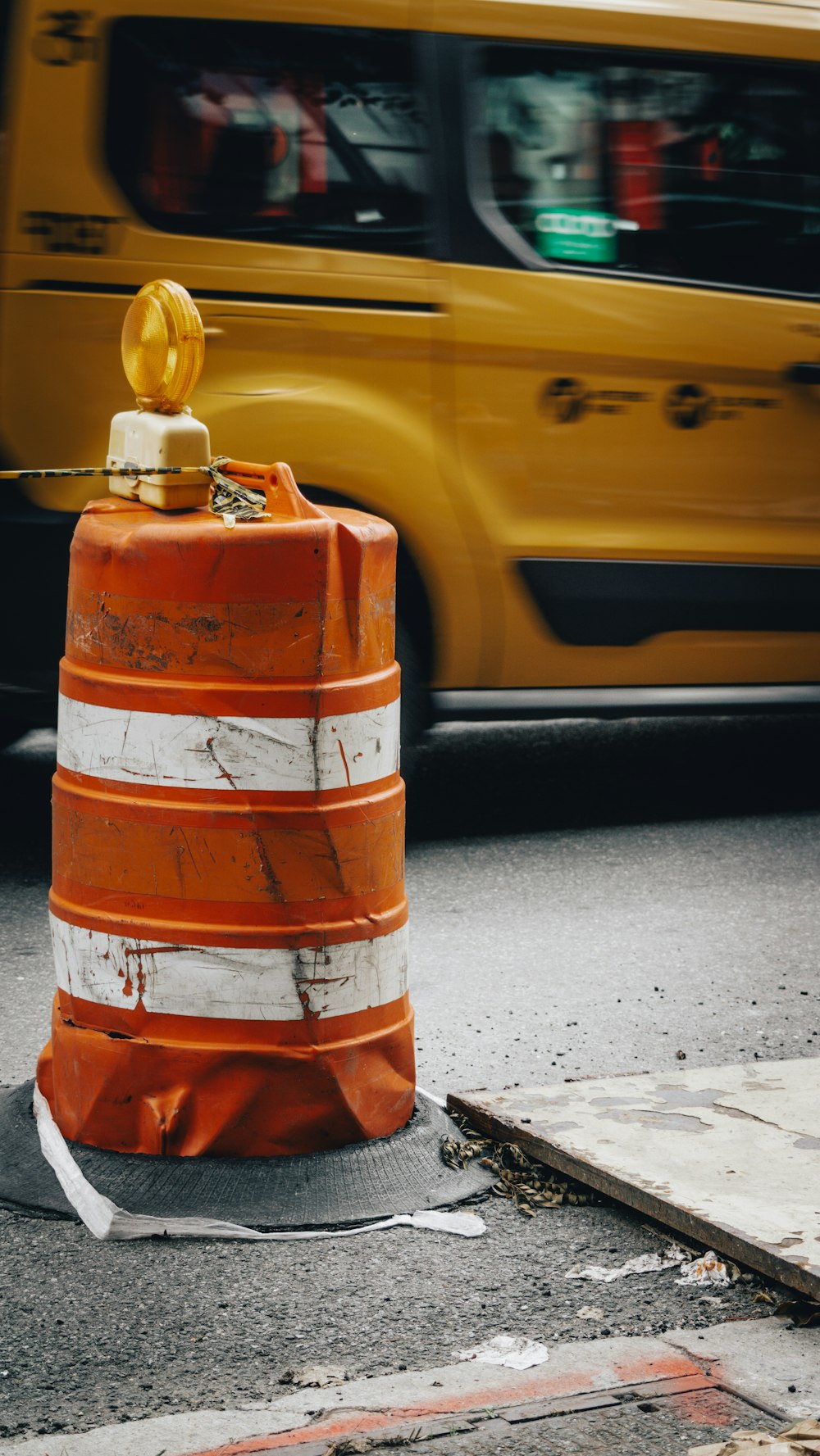 a traffic cone sitting on the side of a road