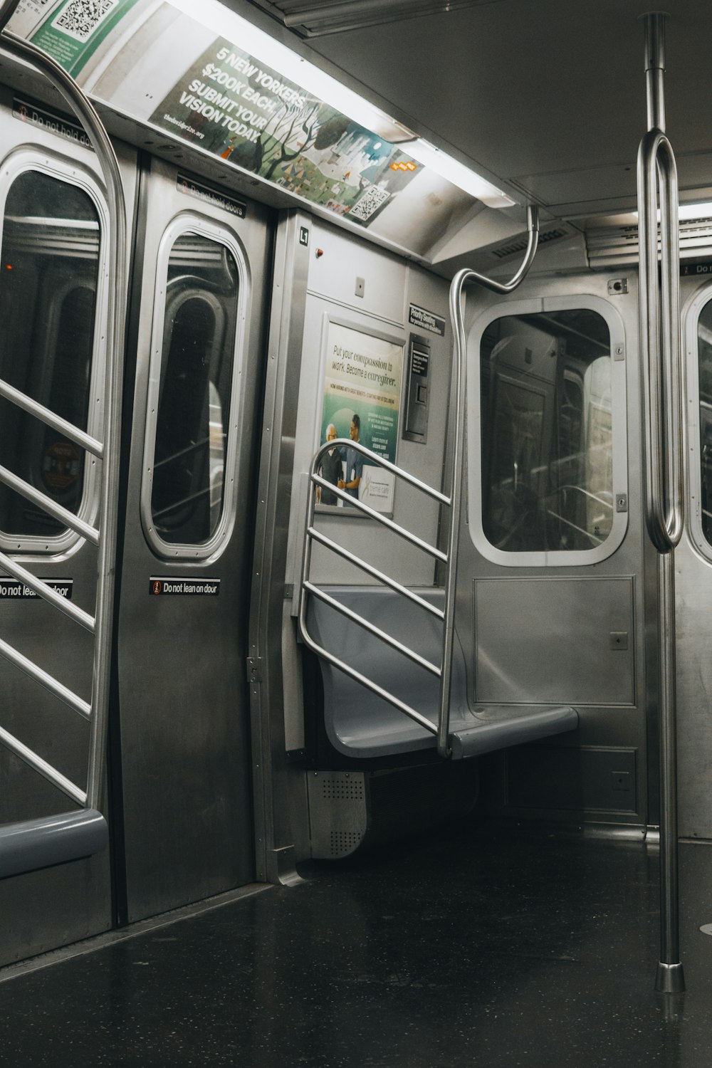 a silver subway car with its doors open
