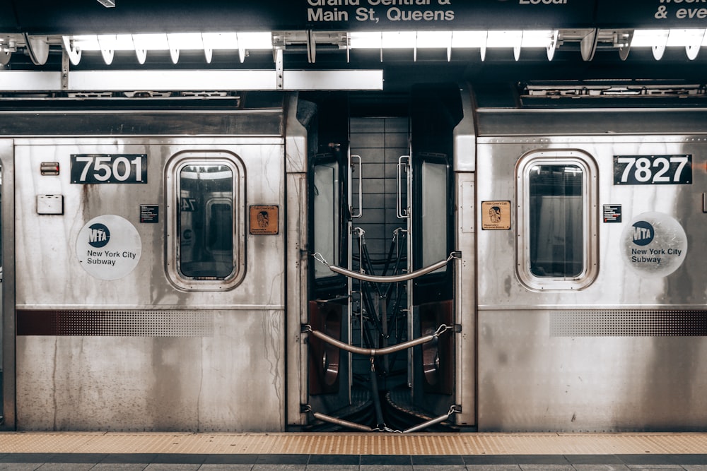 a silver subway train with its doors open