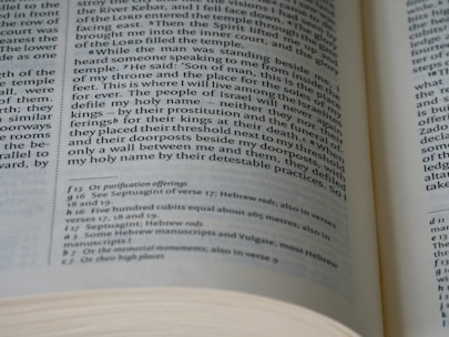 An open book with visible text on both left and right pages. The text is formatted in columns, containing both headings and footnotes. The page numbers and chapters are visible, showcasing detailed content likely from a non-fiction genre.