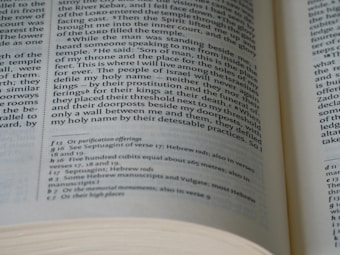 An open book with visible text on both left and right pages. The text is formatted in columns, containing both headings and footnotes. The page numbers and chapters are visible, showcasing detailed content likely from a non-fiction genre.
