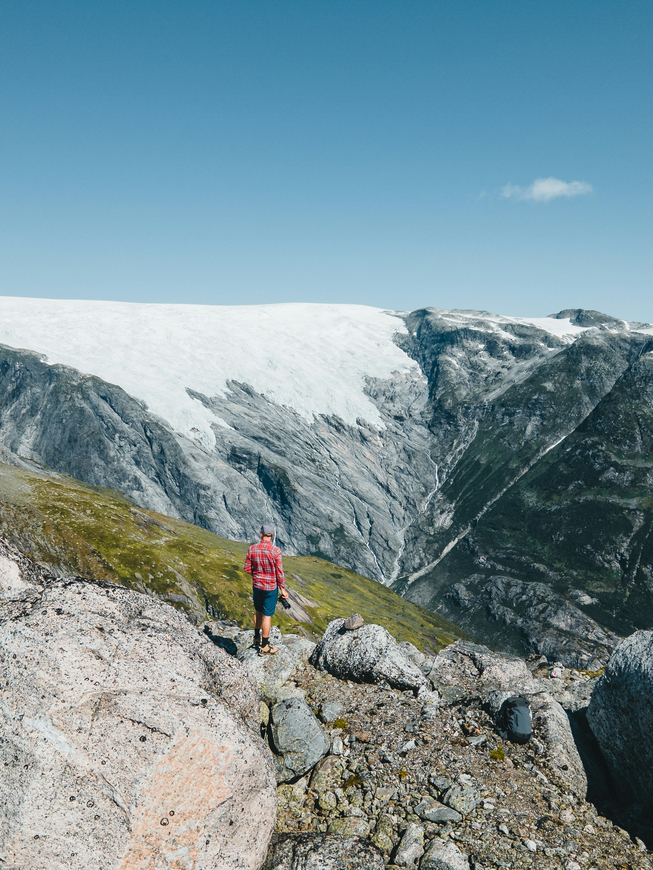 a man standing on top of a rocky mountain