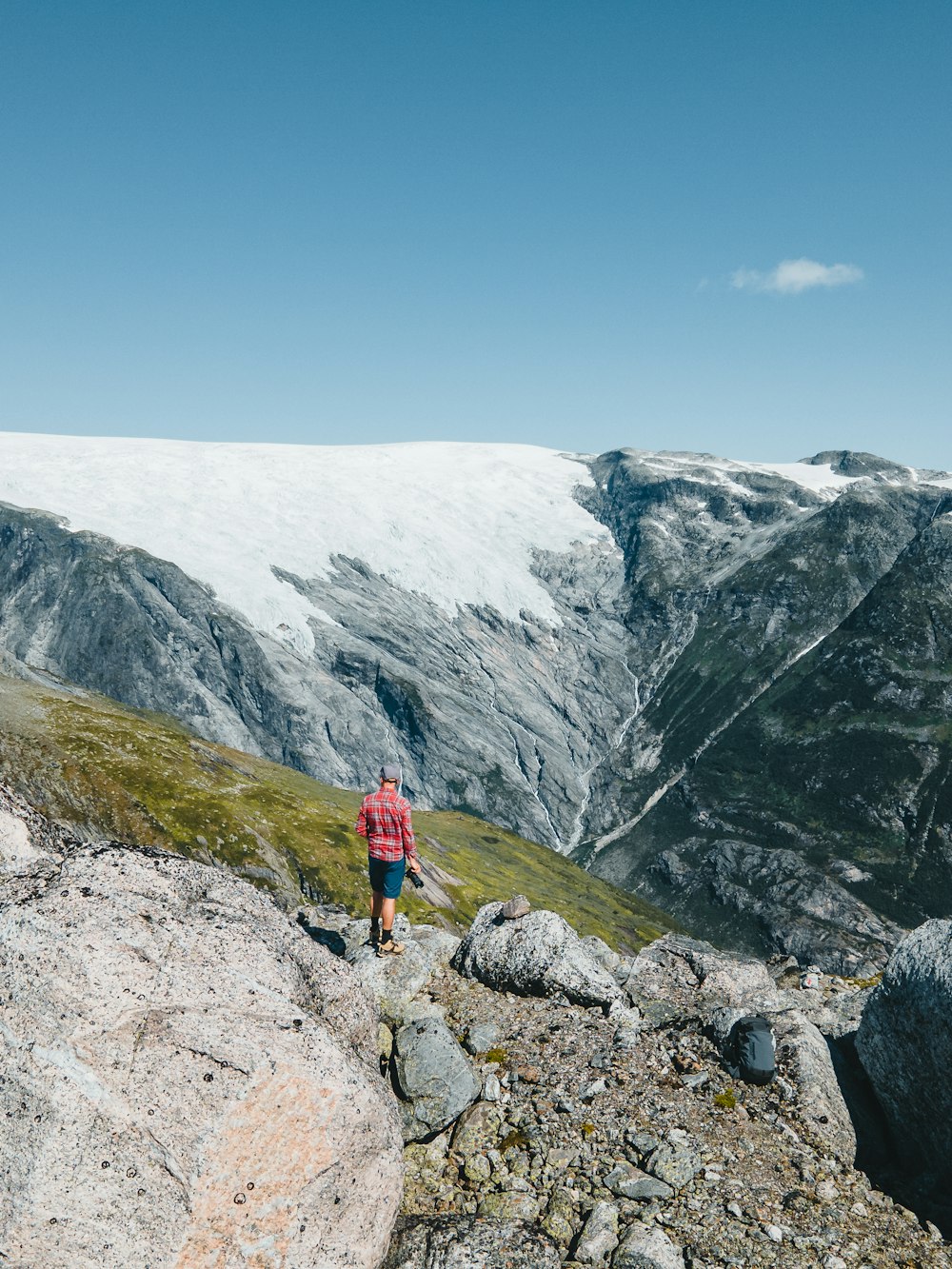 a man standing on top of a rocky mountain