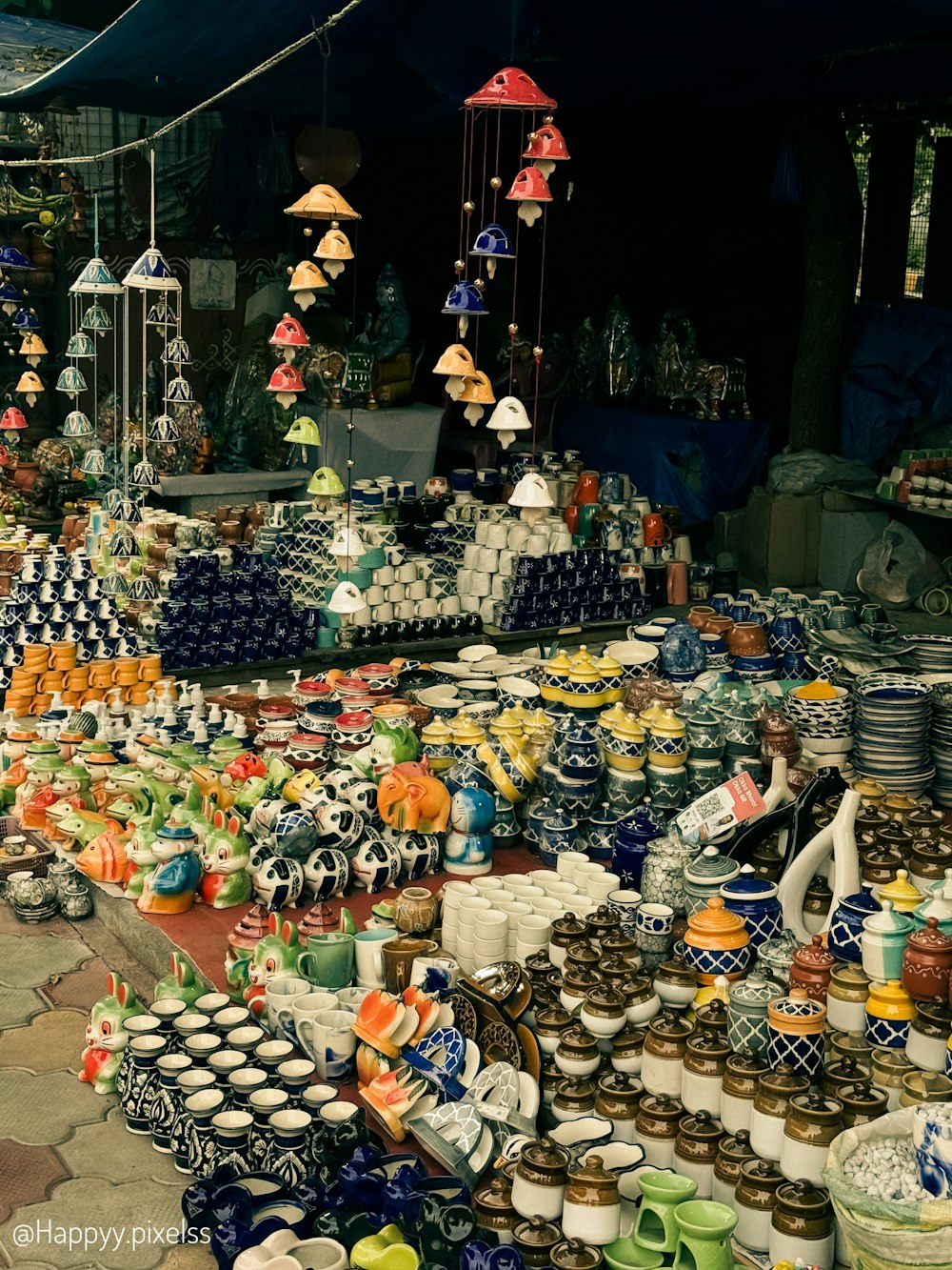 a table filled with lots of different types of pottery