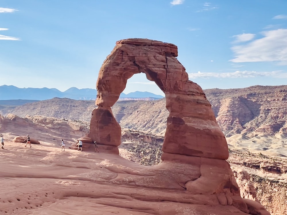 a large rock formation in the middle of a desert