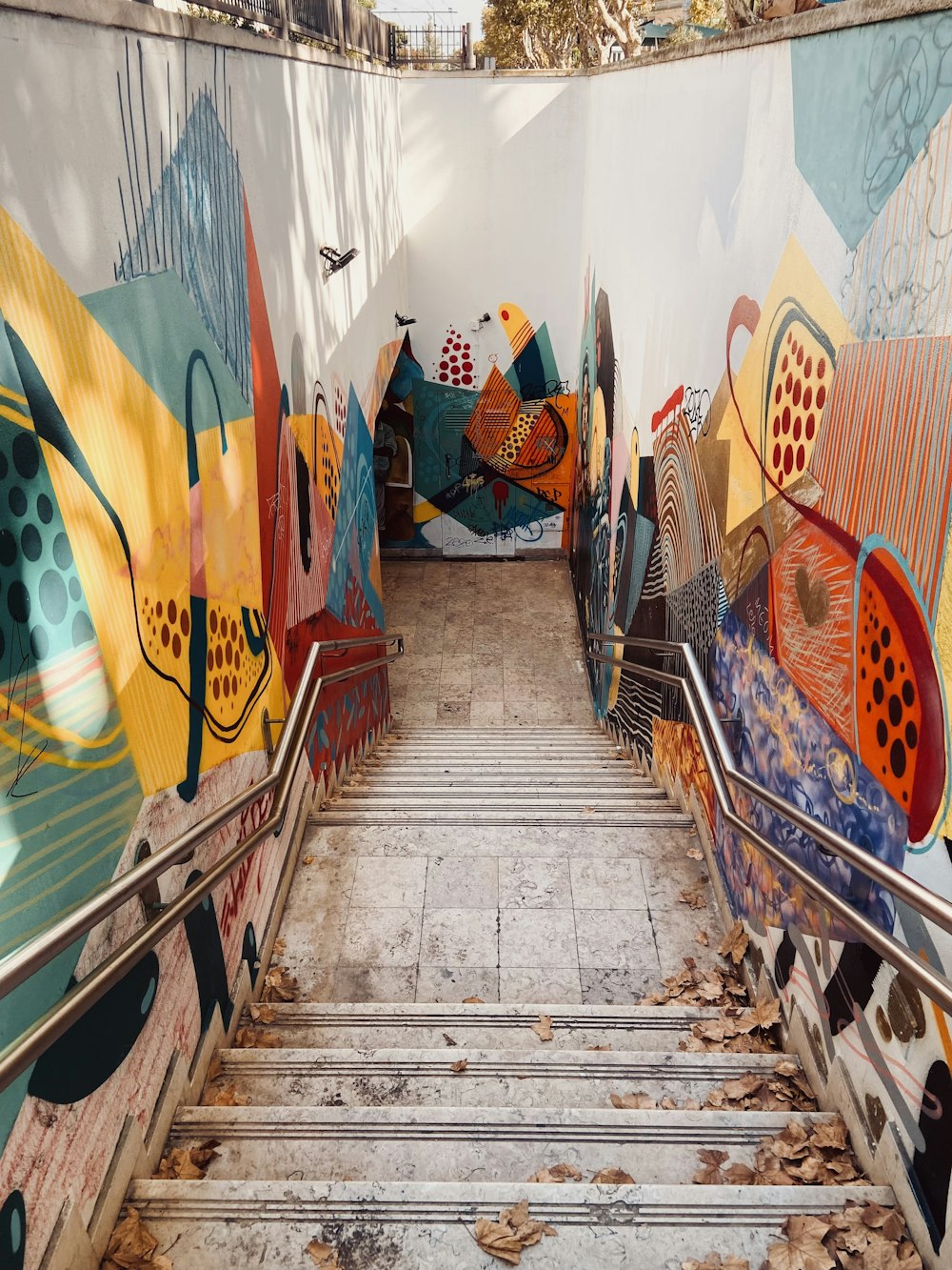 a set of stairs painted with colorful designs