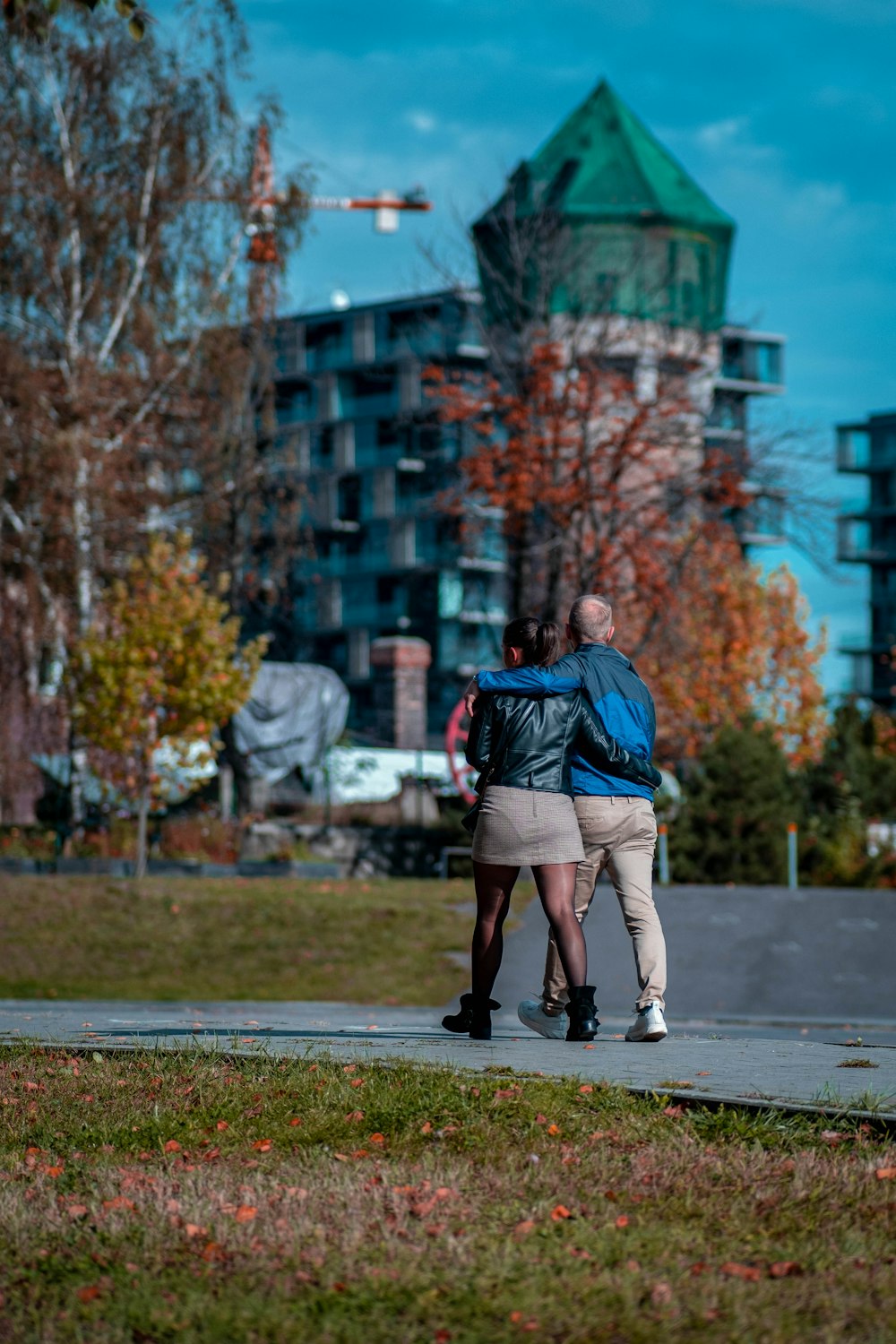 a couple of people that are standing in the grass