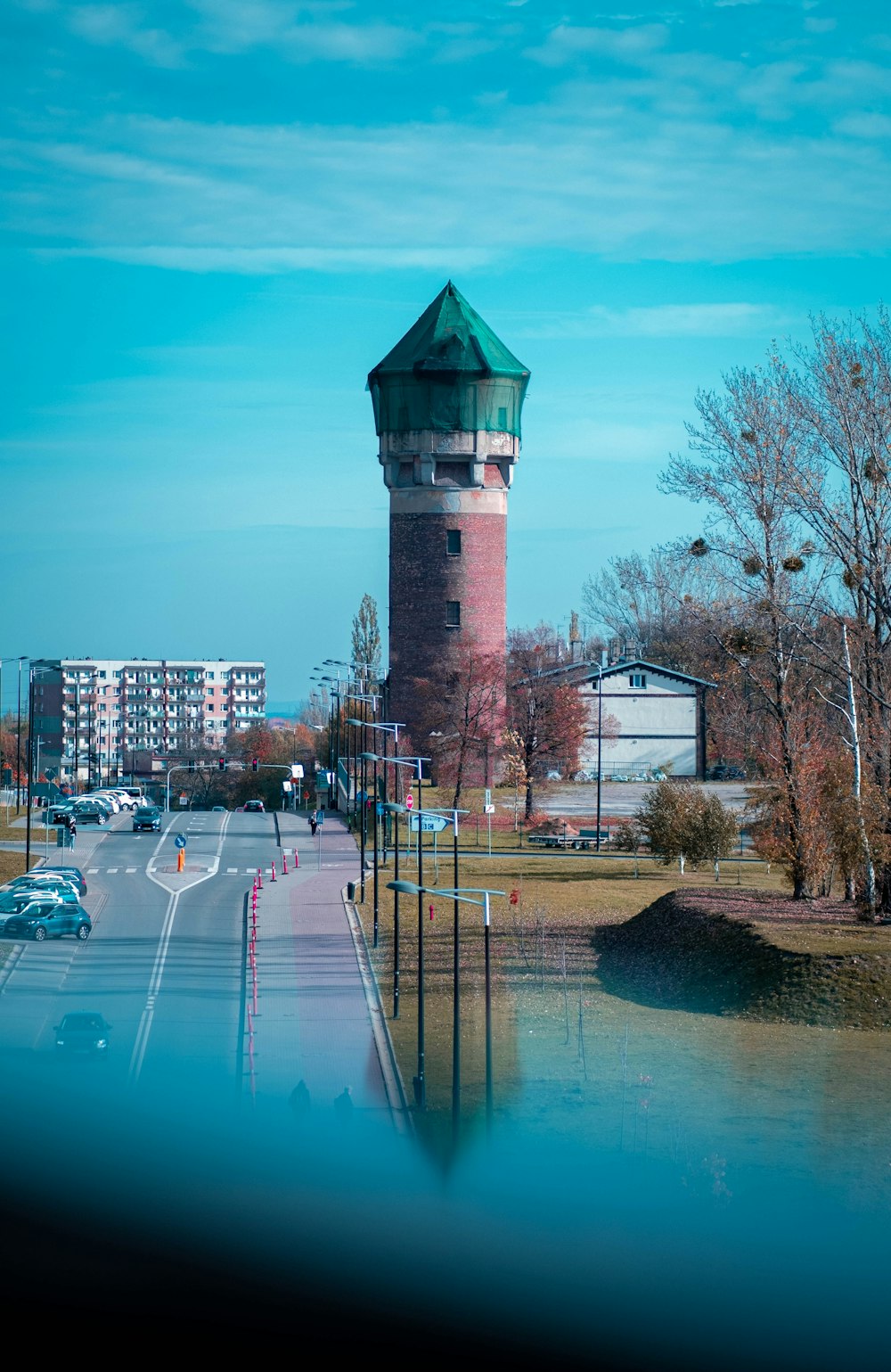 a water tower on the side of a road