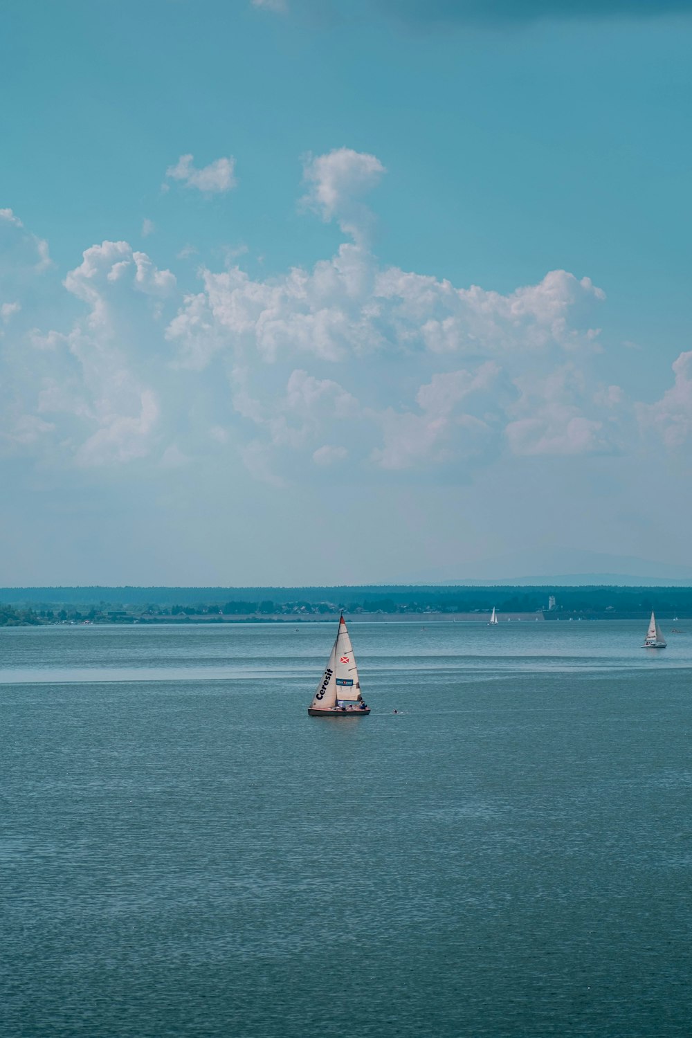 a sailboat in the middle of a large body of water