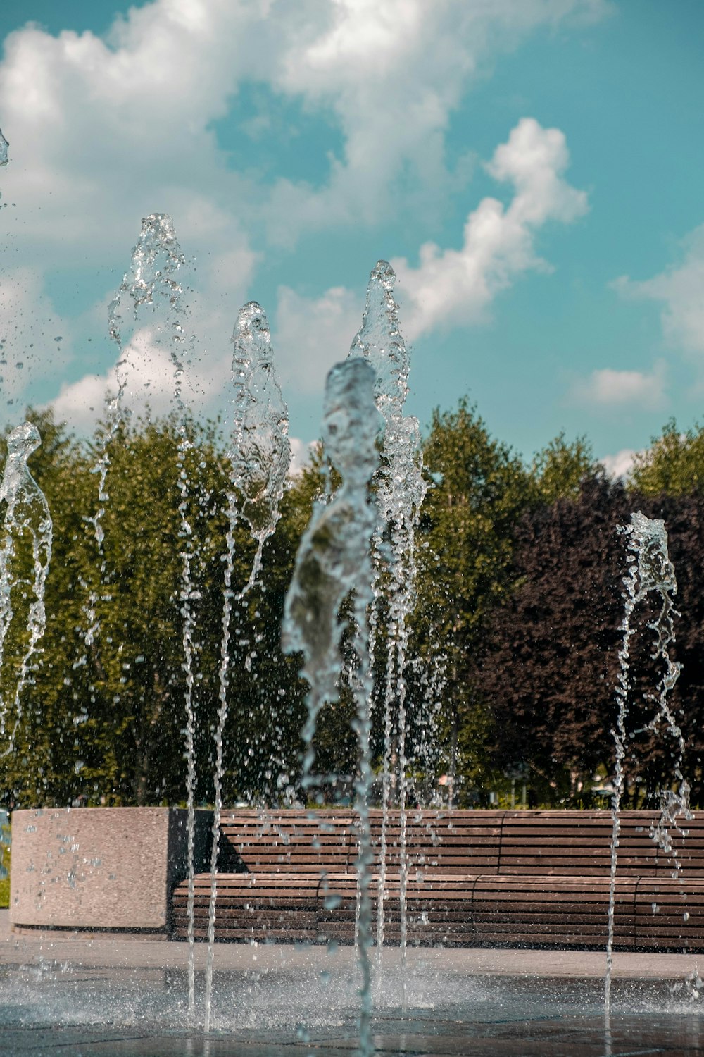 a group of water spouting from a fountain