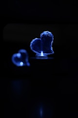 A serene image of a glowing heart surrounded by soft light and gentle sparkles.