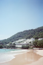 A scenic beach destination with clear blue waters and a cozy resort.