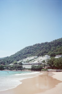 A scenic beach destination with clear blue waters and a cozy resort.