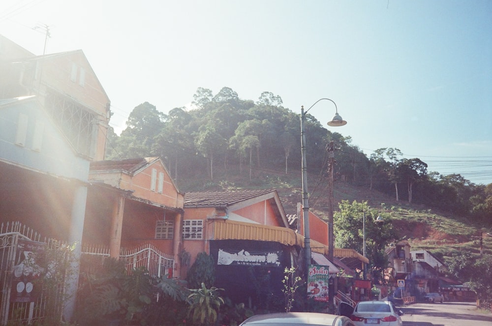 a street scene with cars parked on the side of the road