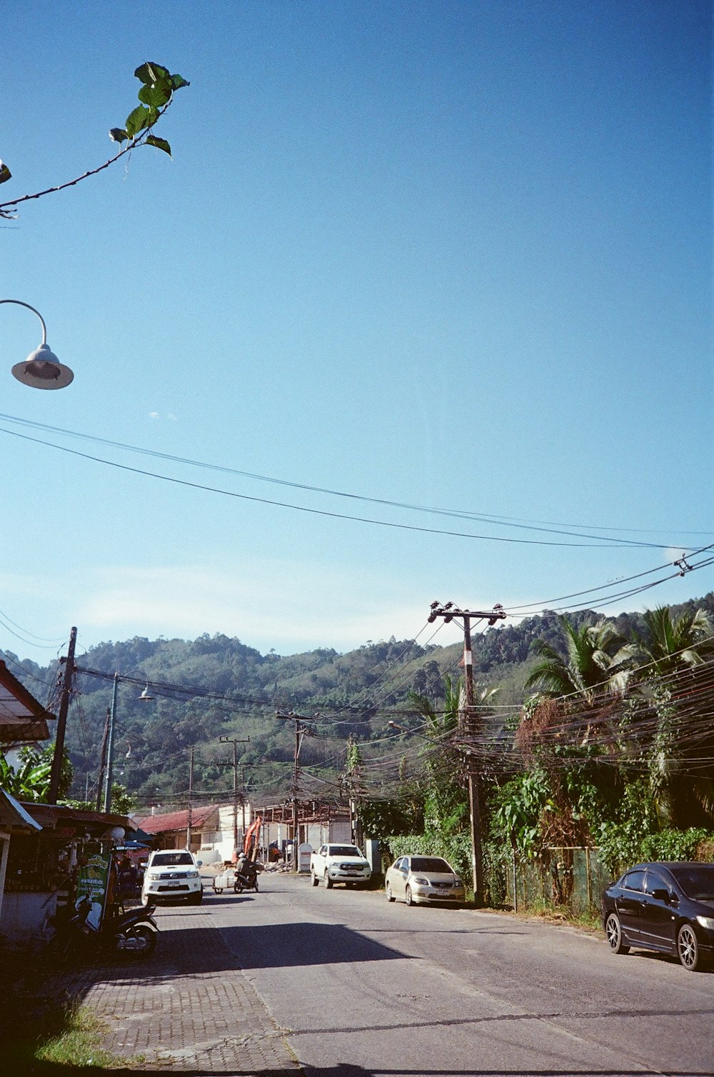 a street with cars parked on the side of it