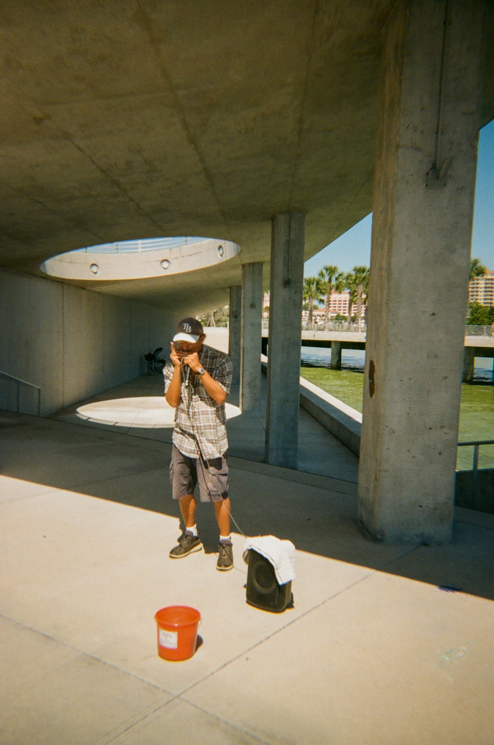 a man taking a picture of himself in front of a building