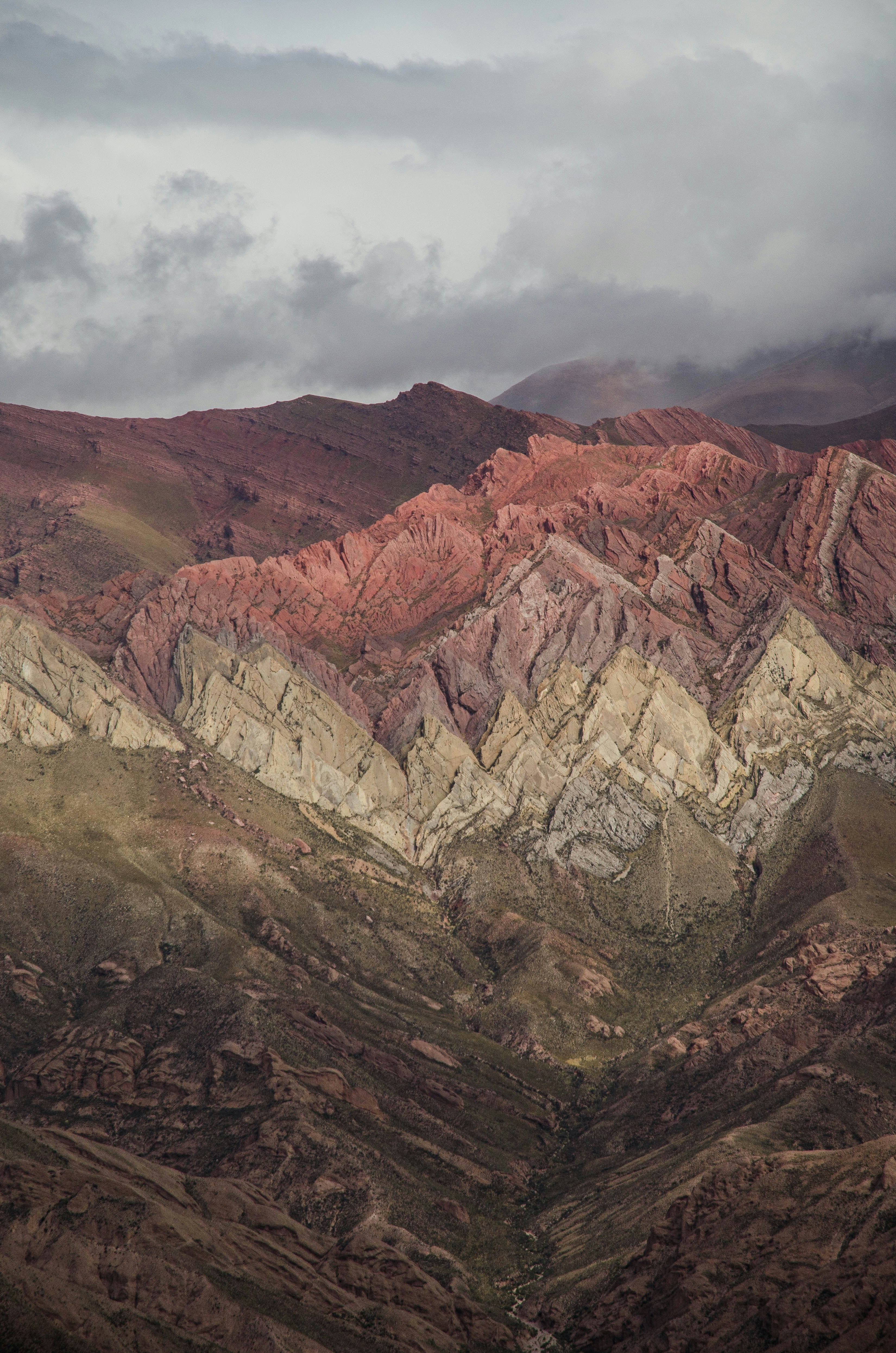 a view of a mountain range with a cloudy sky