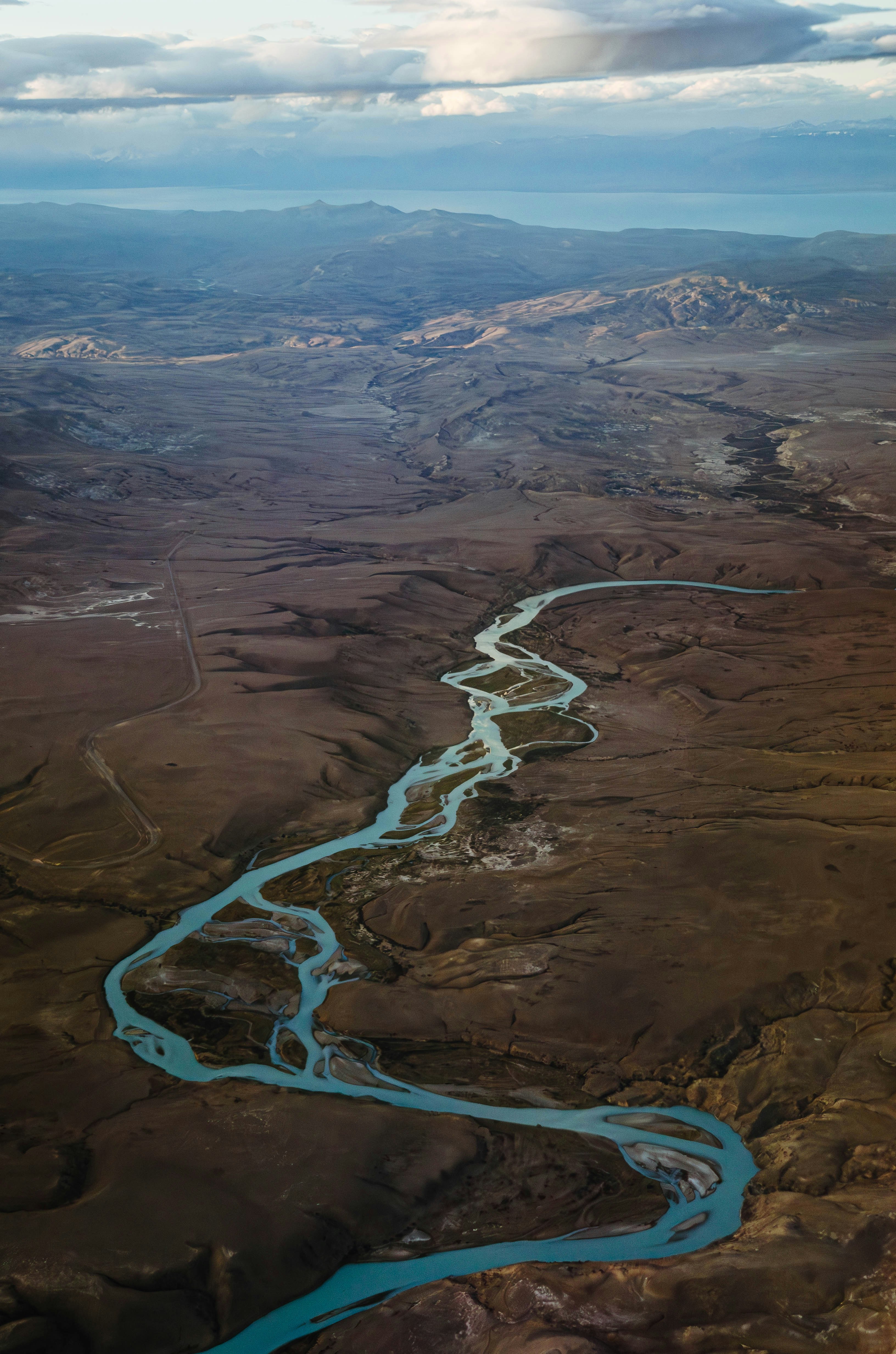 an aerial view of a river running through a valley
