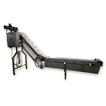 The image features a piece of industrial equipment, specifically a conveyor belt system with an angled section for transporting items. It includes a motorized control unit and support structure with metal components.
