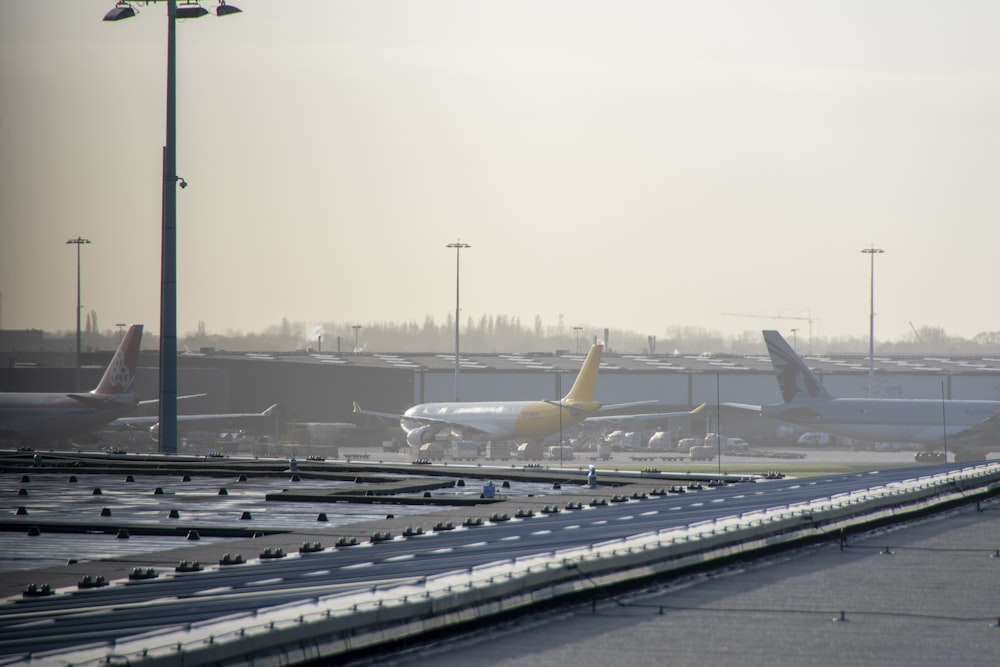 an airport filled with lots of parked airplanes