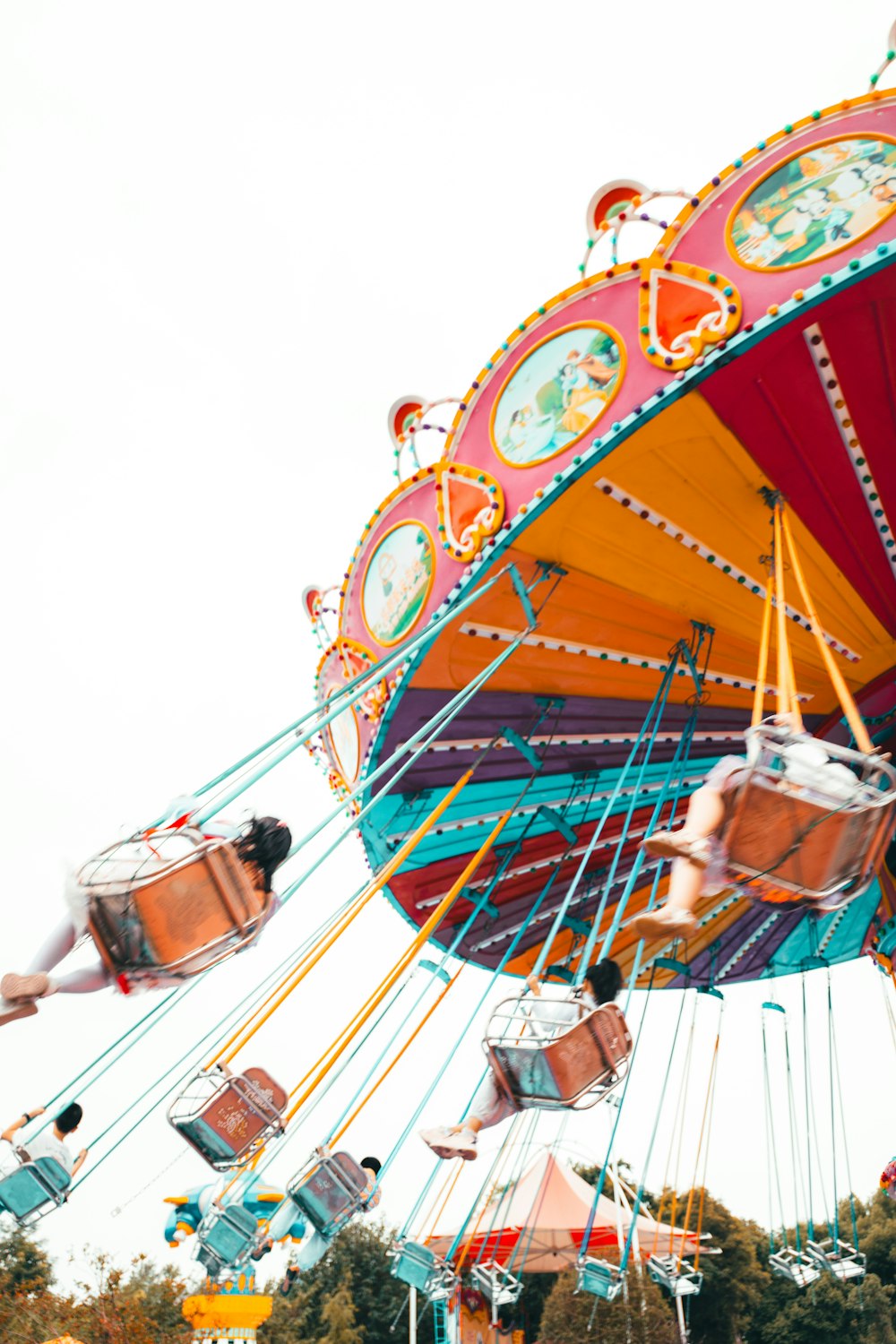 a carnival ride with people riding on it