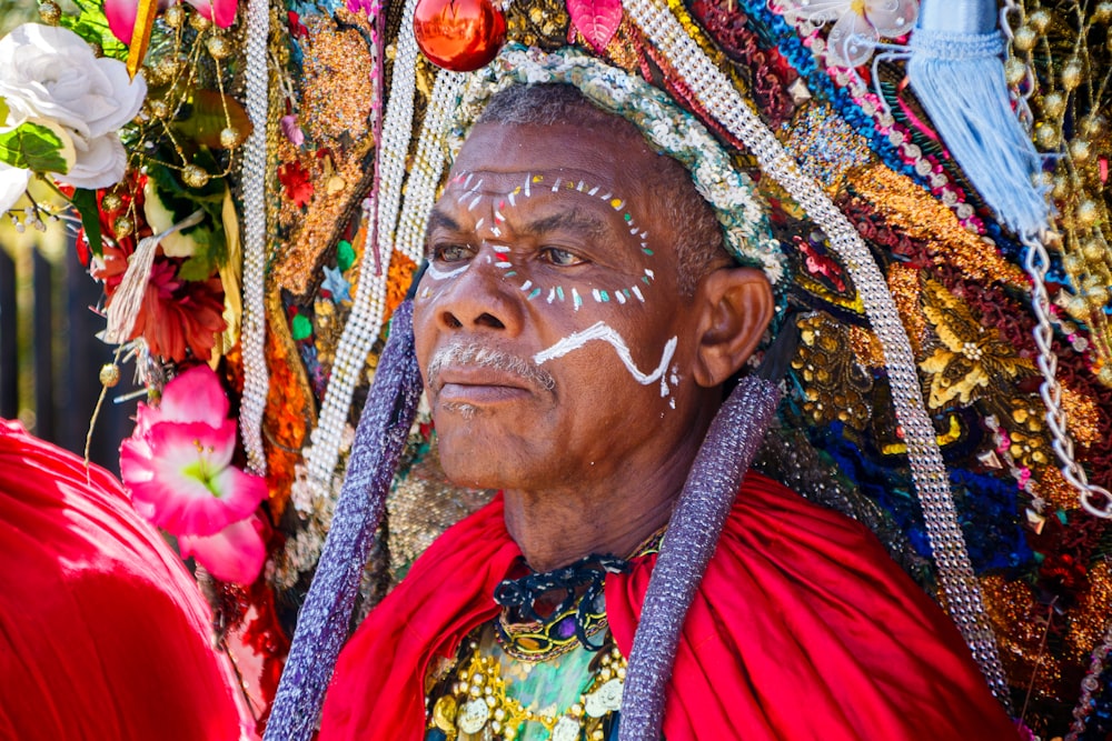 a man with white face paint on his face