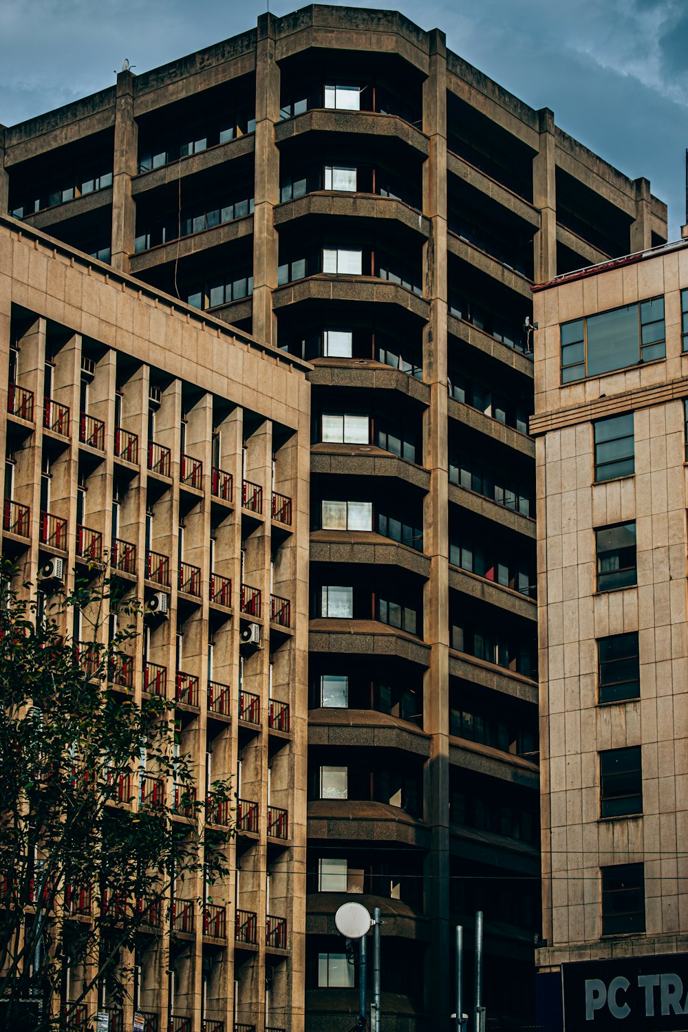 a tall building with balconies on top of it