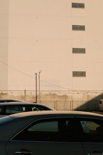 Close-up of the building’s secure fencing and parking area.